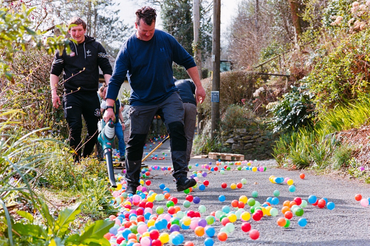 Colourful ball race on a village lane at Gwaelod y Garth