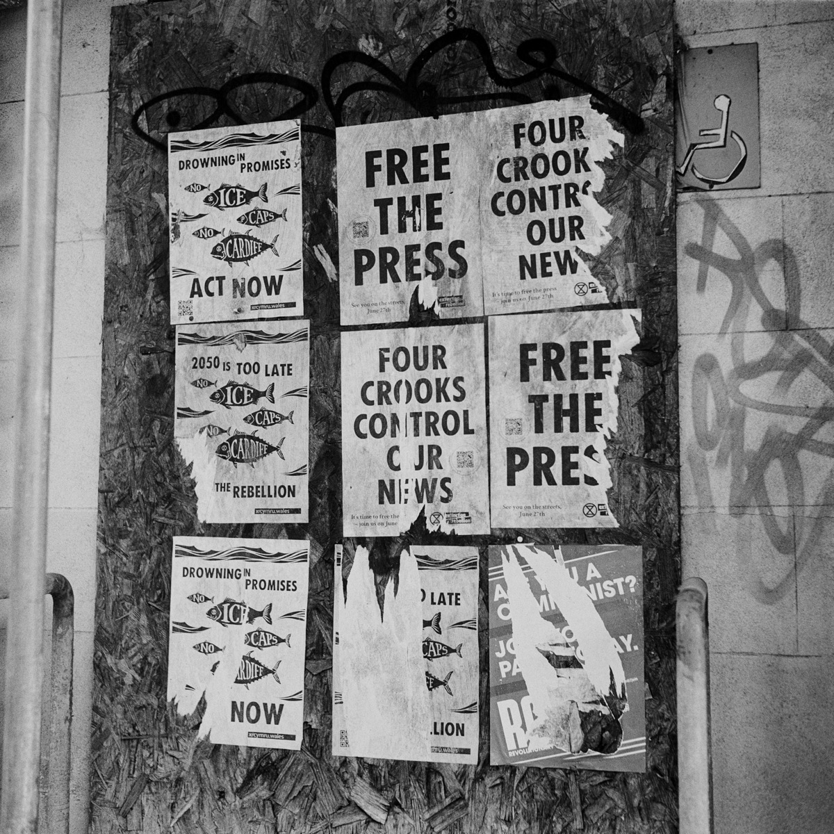 Layered posters on a Cardiff wall