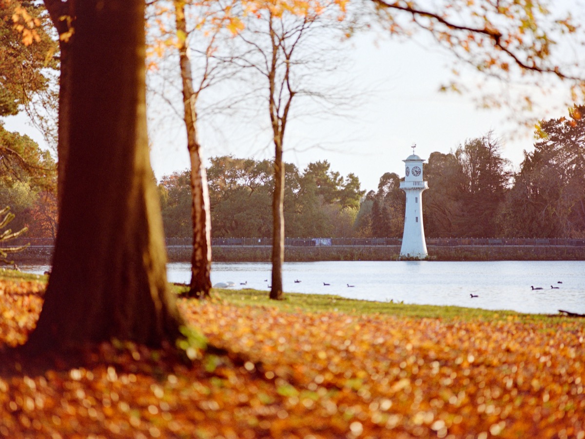 Roath Park clock tower and lake in autumn, Cardiff